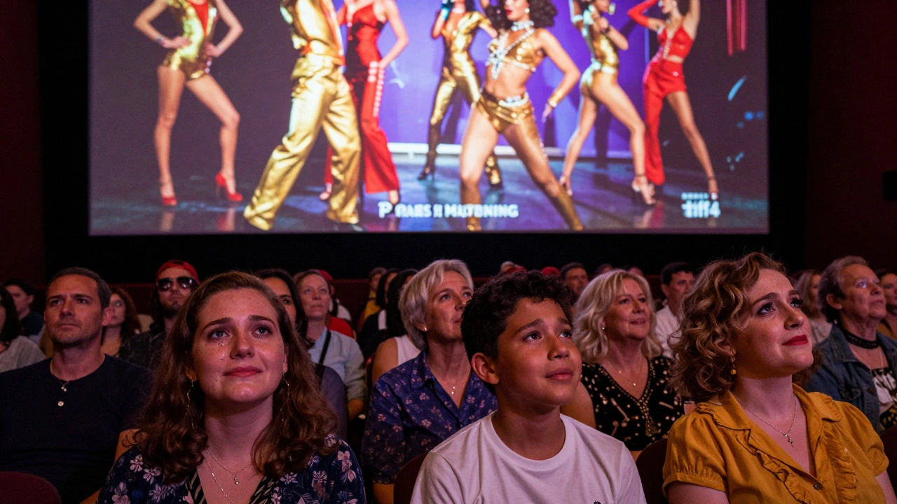 A diverse audience watching 'Paris Is Burning' in a darkened theater, lit by the film's colorful glow.
