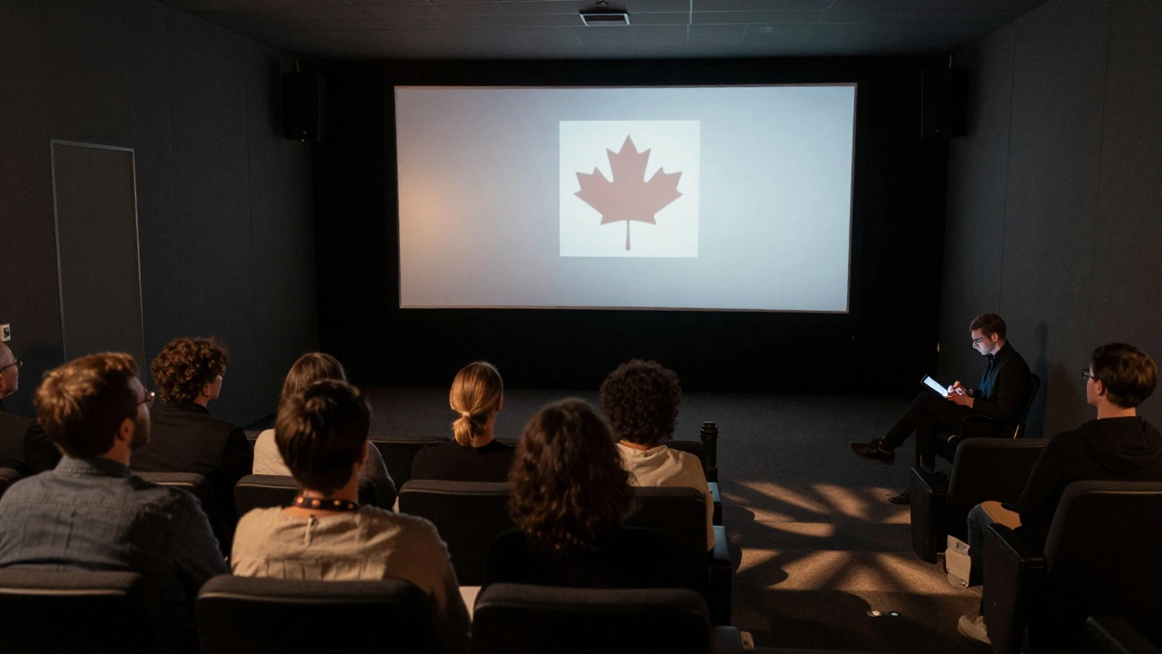 A small audience watches a co-produced film in a quiet Venice screening room, projector light casting shadows across empty seats.