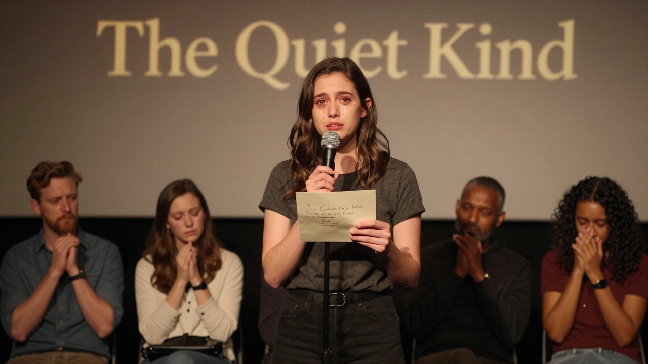 A young actress holding a handwritten letter during an emotional Q&amp;A, tears in her eyes as audience members respond quietly.