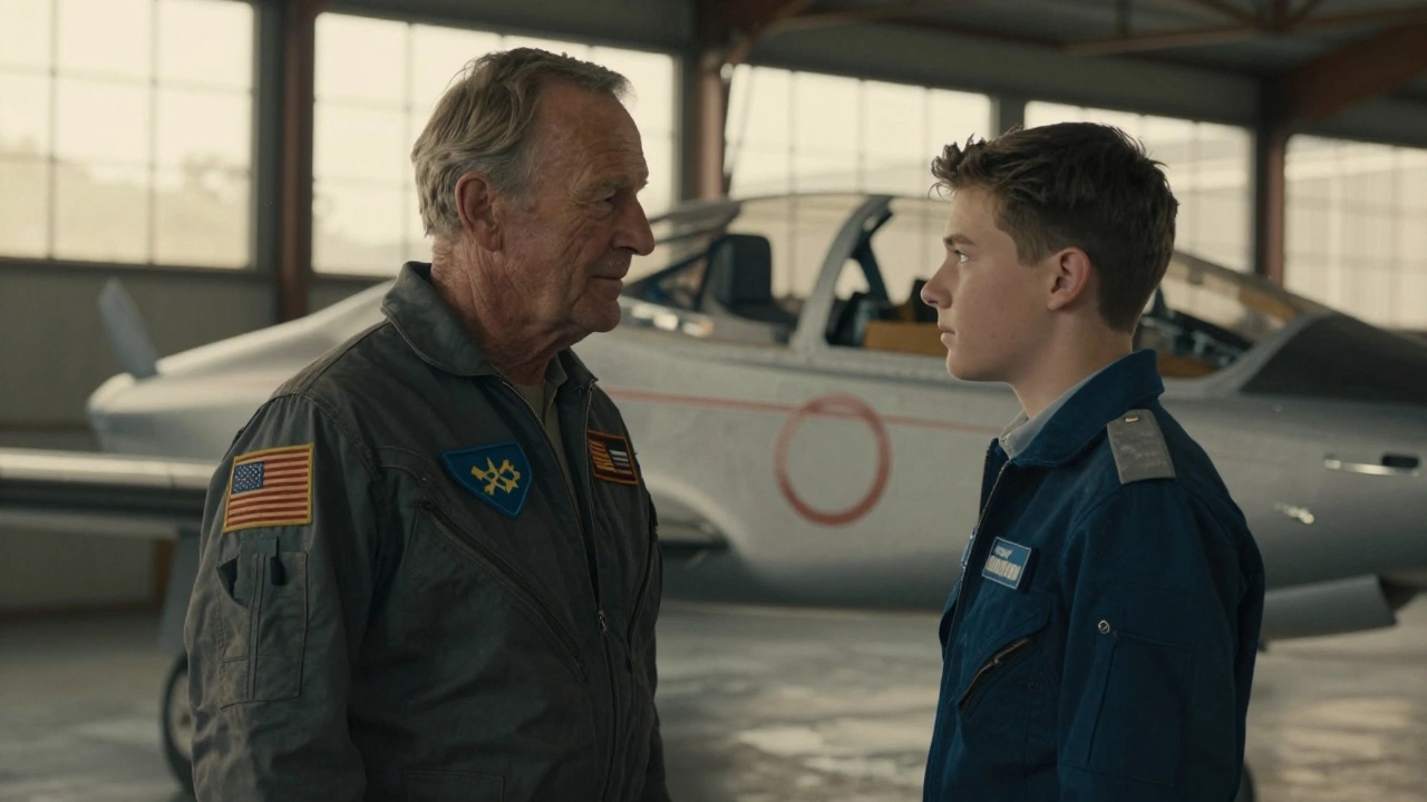 An older veteran pilot mentoring a young pilot in a sunlit aircraft hangar.