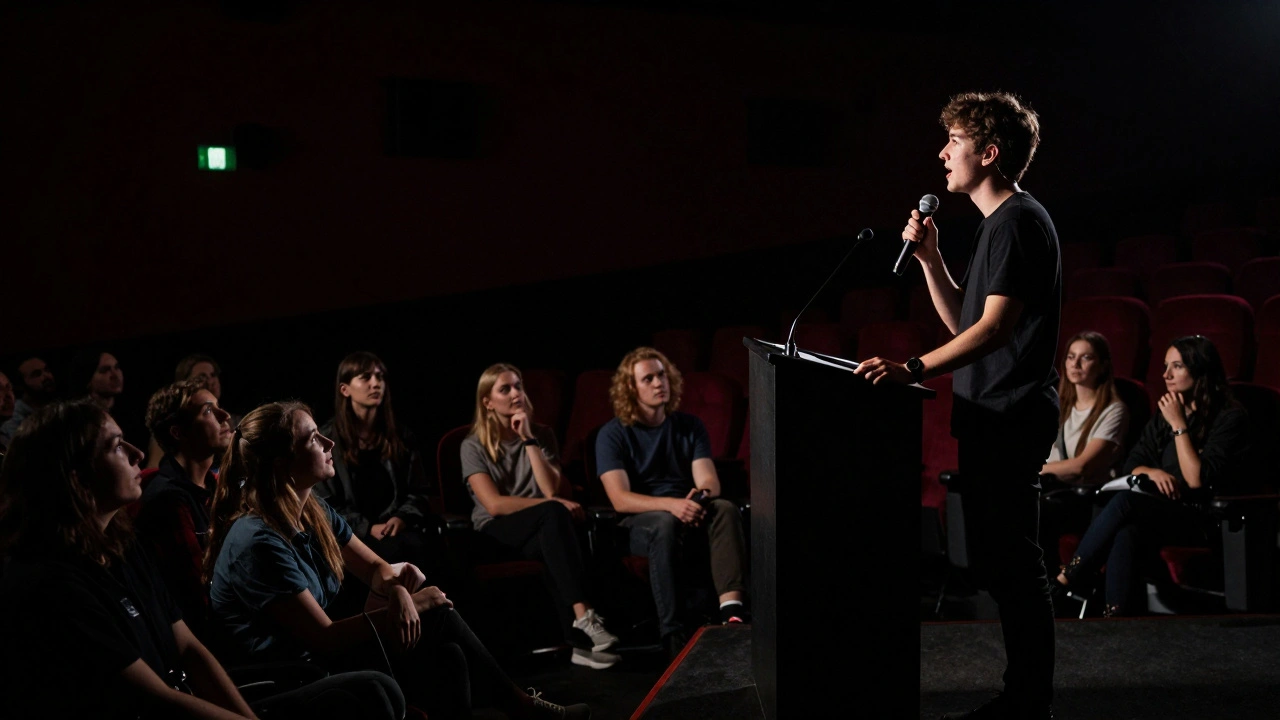 Director speaking at a podium during a post-screening Q&amp;A session