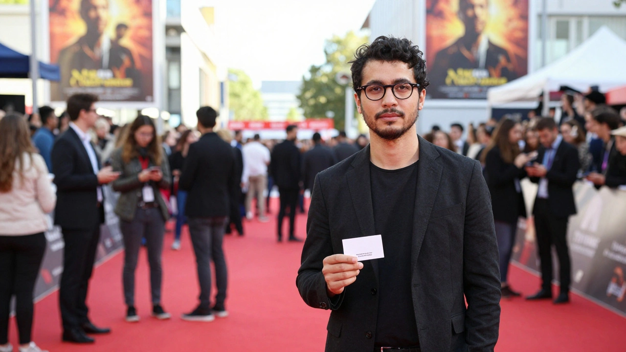 Writer networking at a busy film festival with editors in the background.