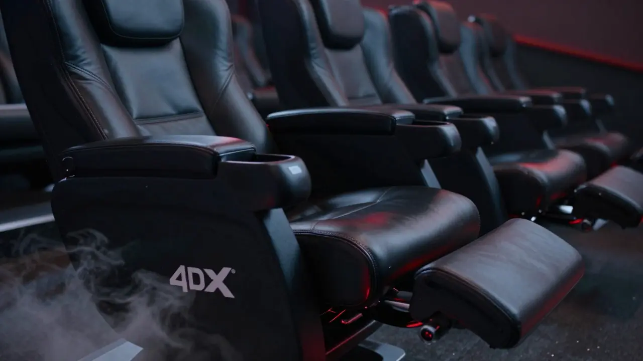 Close-up of a 4DX motion seat with mist effects in a dark room